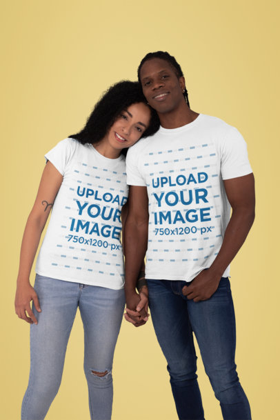 T-Shirt Mockup Featuring a Couple Holding Hands in a Studio