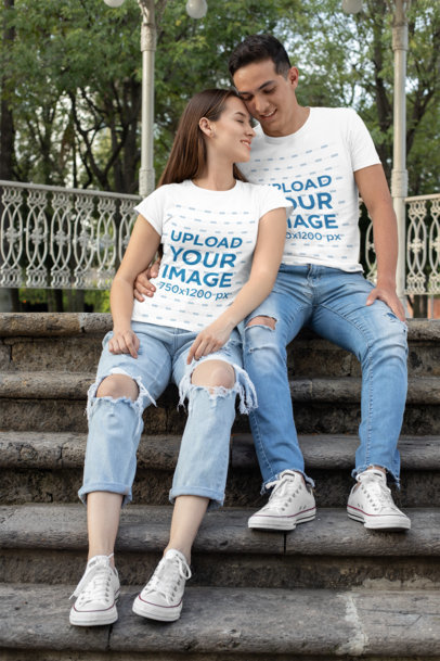 T-Shirt Mockup of a Romantic Couple Sitting on the Stairs 