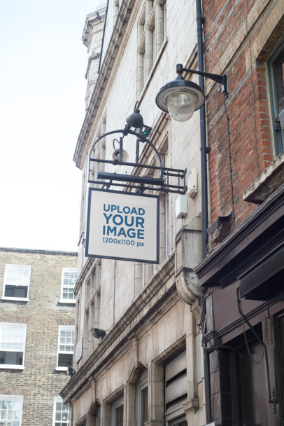 Mockup of a Squared Sign Hanging Next to a Lamp 