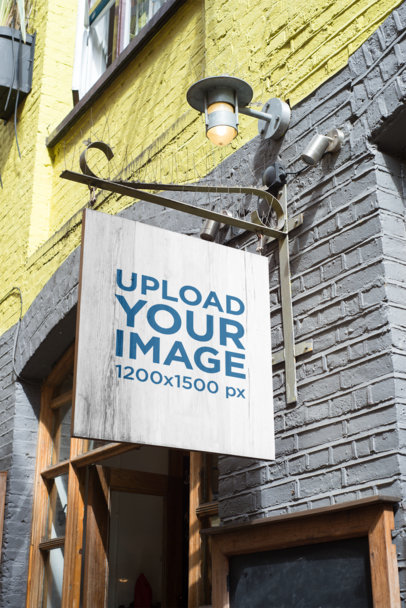 Mockup of a Sign Attached to a Classic-Looking Building