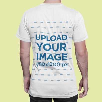 T-Shirt Mockup of a Man Standing Backward in a Studio
