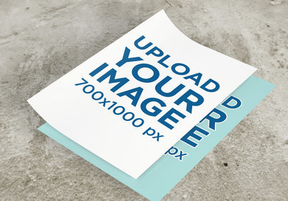 Mockup of Two Flyers Placed over a Concrete Surface 
