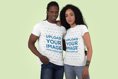 T-Shirt Mockup Featuring a Man and a Woman at a Studio 