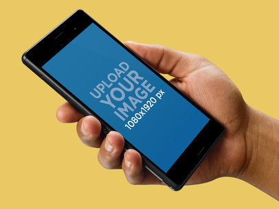 Android Phone in Hand Mockup Over a Transparent Background