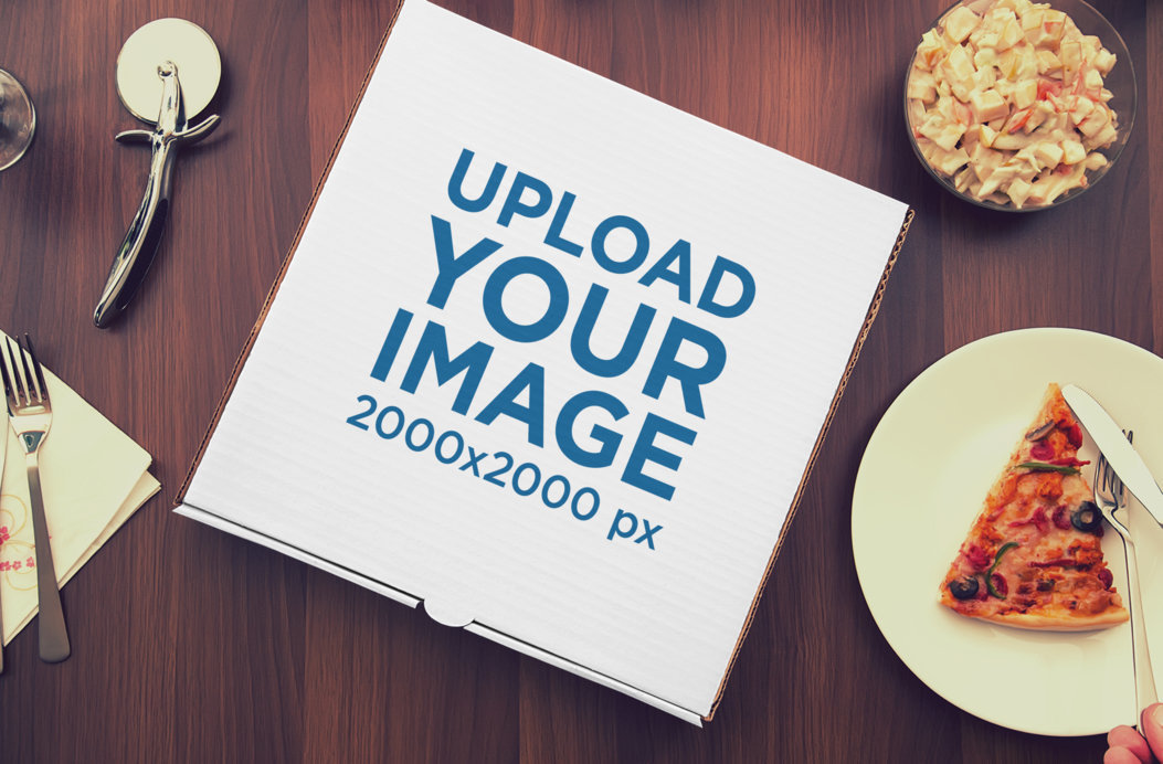 Mockup of a Pizza Box Surrounded By Food 