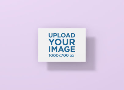 Mockup of a Horizontal Postcard Floating in a Plain-Color Background
