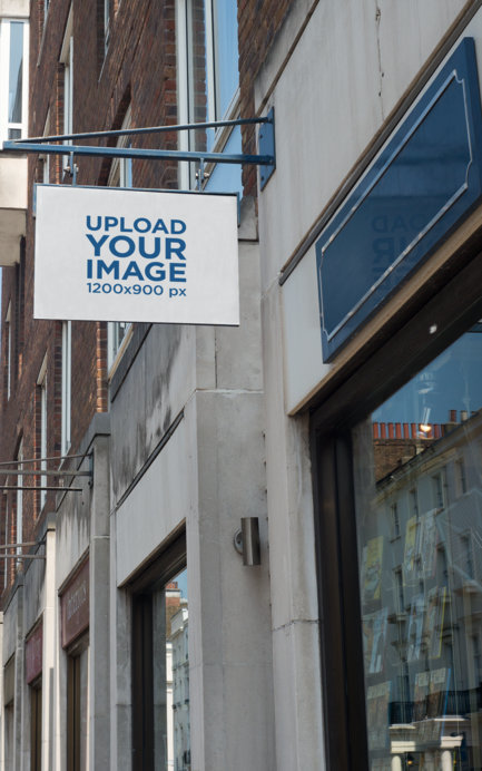 Store Sign Mockup Placed on an Old Building