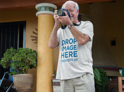 T-Shirt Mockup of a White Senior Taking a Photograph