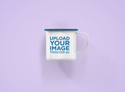 Mockup of a 12 oz Enamel Coffee Mug with a Customizable Rim Against a Flat Background