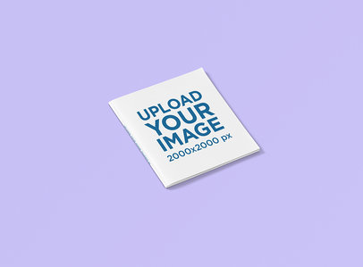 Square Magazine Mockup Featuring a Plain Color Background 