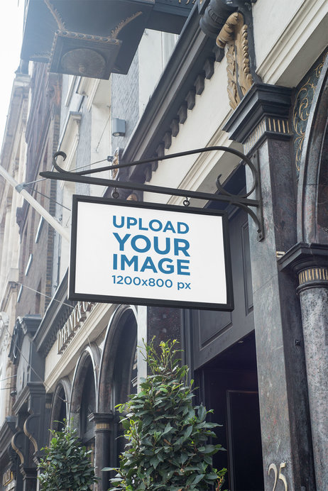 Placeit - Mockup of a Framed Sign Attached to a Classy Building Wall
