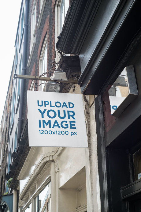 Placeit - Squared Store Sign Mockup Placed on a Vintage Building