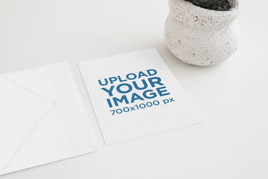 Mockup of a Postcard and an Envelope Beside a Small Plant Pot