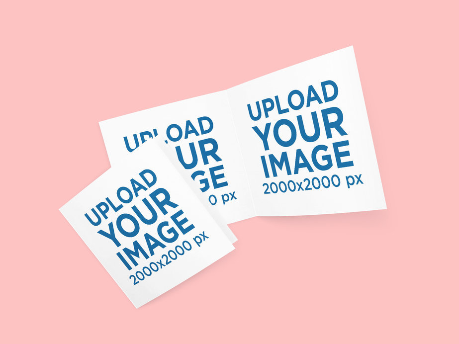 Mockup of Two Open Greeting Cards Placed Against a Flat Surface