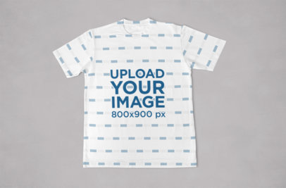 Mockup of a Sublimated T-Shirt Flat Laid Against a Solid Background