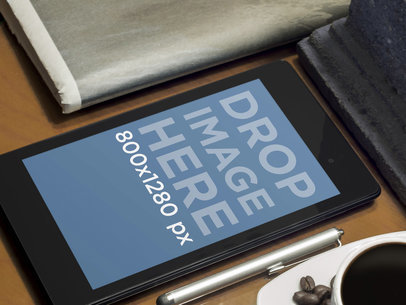 Mockup of a Nexus 7 Placed On a Table By a Coffee Cup