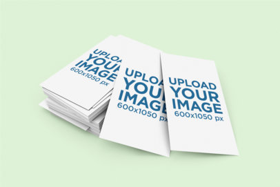 Mockup of a Pile of Vertical Business Cards on a Plain Background 