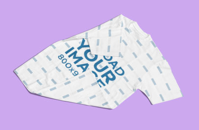 Mockup of a Sublimated Tee Randomly Placed on a Solid Color Surface 1388-el
