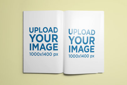 Mockup of an Open Book on a Colored Surface 1341-el