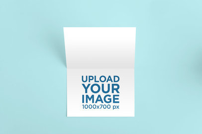Mockup of a Horizontal Greeting Card on a Solid Surface 