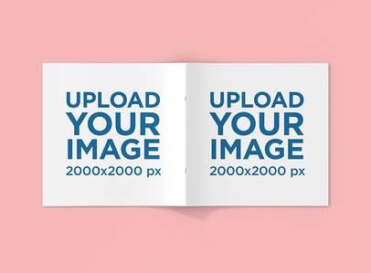 Mockup Featuring an Open Square Booklet Placed over a Solid Color Surface 1509-el