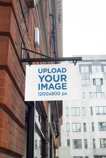 Mockup of a Store Sign Placed on a Building's Corner 