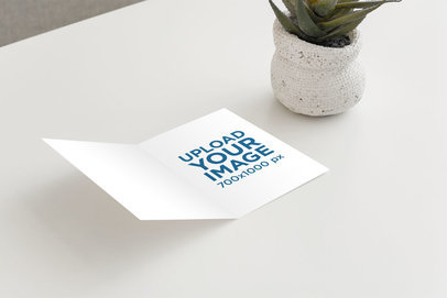 Greeting Card Mockup Featuring a Desert Plant and a White Surface 944-el