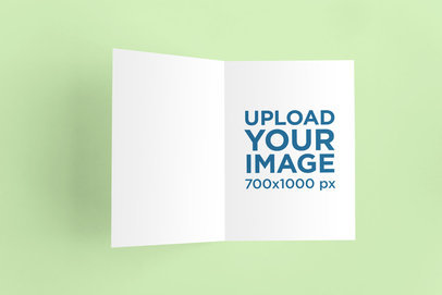 Mockup of an Open Greeting Card Placed on a Flat Surface 