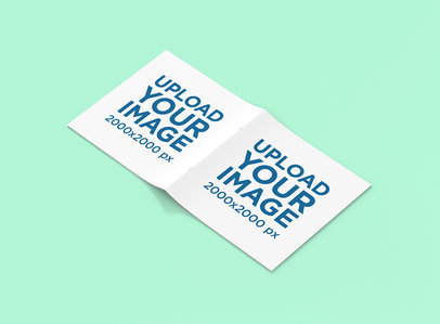 Square Magazine Mockup Featuring an Open Magazine Lying Cover-Side Up