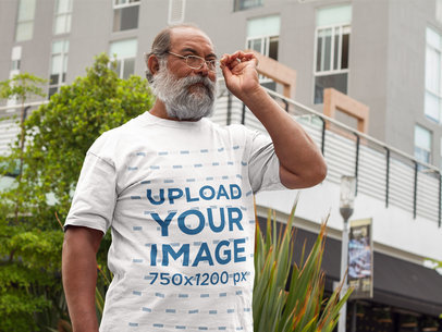 T-Shirt Mockup of a Hispanic Senior Wearing Glasses