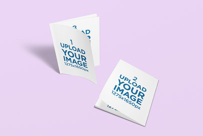 Mockup of Two Booklets Against a Customizable Backdrop 