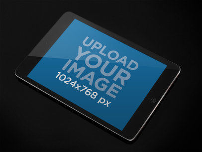  iPad Mini Mockup Featuring a Dark Color Surface 
