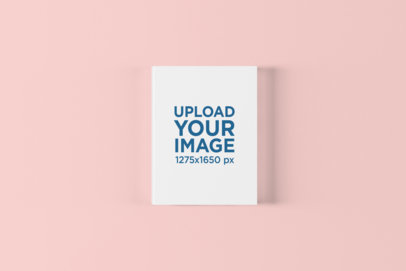 Mockup of a Hardcover Book on a Solid Color Surface