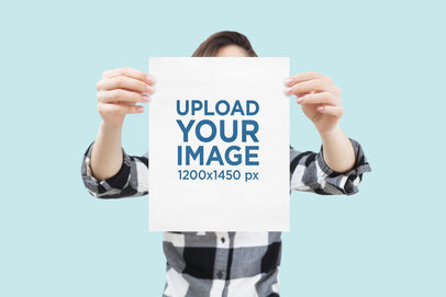 Mockup of a Woman Covering Herself with an A4 Poster