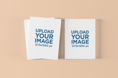 Mockup of Some Hardcover Books on a Solid Color Surface