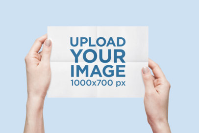 Mockup of a Woman Holding a Flyer with Folding Marks 1326-el