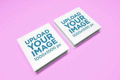 Mockup of Two Square Books Against a Customizable Surface 