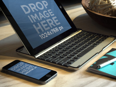 Mockup Featuring an iPad on a Keyboard Deck and an iPhone 5s Placed on a Table 