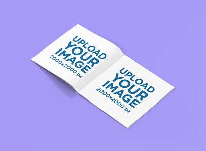 Mockup of an Open Squared Magazine on a Solid Color Surface