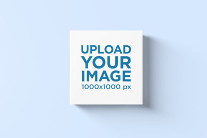 Minimal Mockup Featuring a Hardcover Square Book Placed on a Plain Color Surface 1545-el