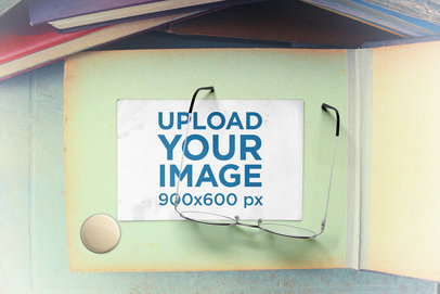 Mockup of a Postcard Under a Pair of Glasses