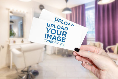 Mockup of a Woman Holding Two Gift Vouchers 