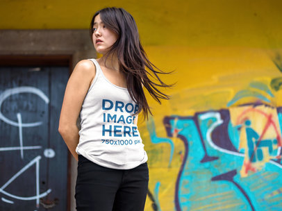 Tank Top Mockup Featuring a Pretty Asian Woman Near Urban Art