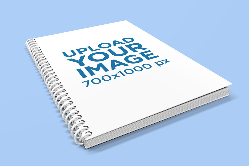 Placeit - Mockup of a Spiral Notebook Placed on a Flat Surface