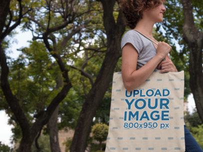 Canvas Tote Bag Mockup Featuring a Woman in a Park