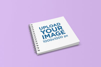 Square Notebook Mockup Featuring a Plain Color Surface 1714-el