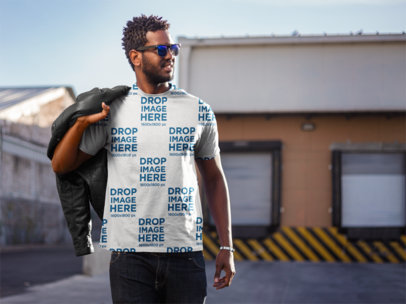 T-Shirt Mockup Featuring a Young Man with Curly Hair 
