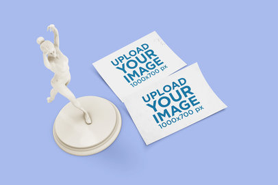 Mockup Featuring Two Postcards Placed by a Ballerina Sculpture 1438-el