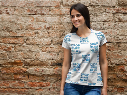 Sublimated Tee Mockup of a Young Woman Leaning Against a Brick Wall