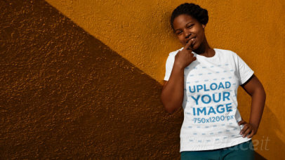 Stop Motion Video of a Woman with a T-Shirt Leaning on a Bicolor Wall 22998